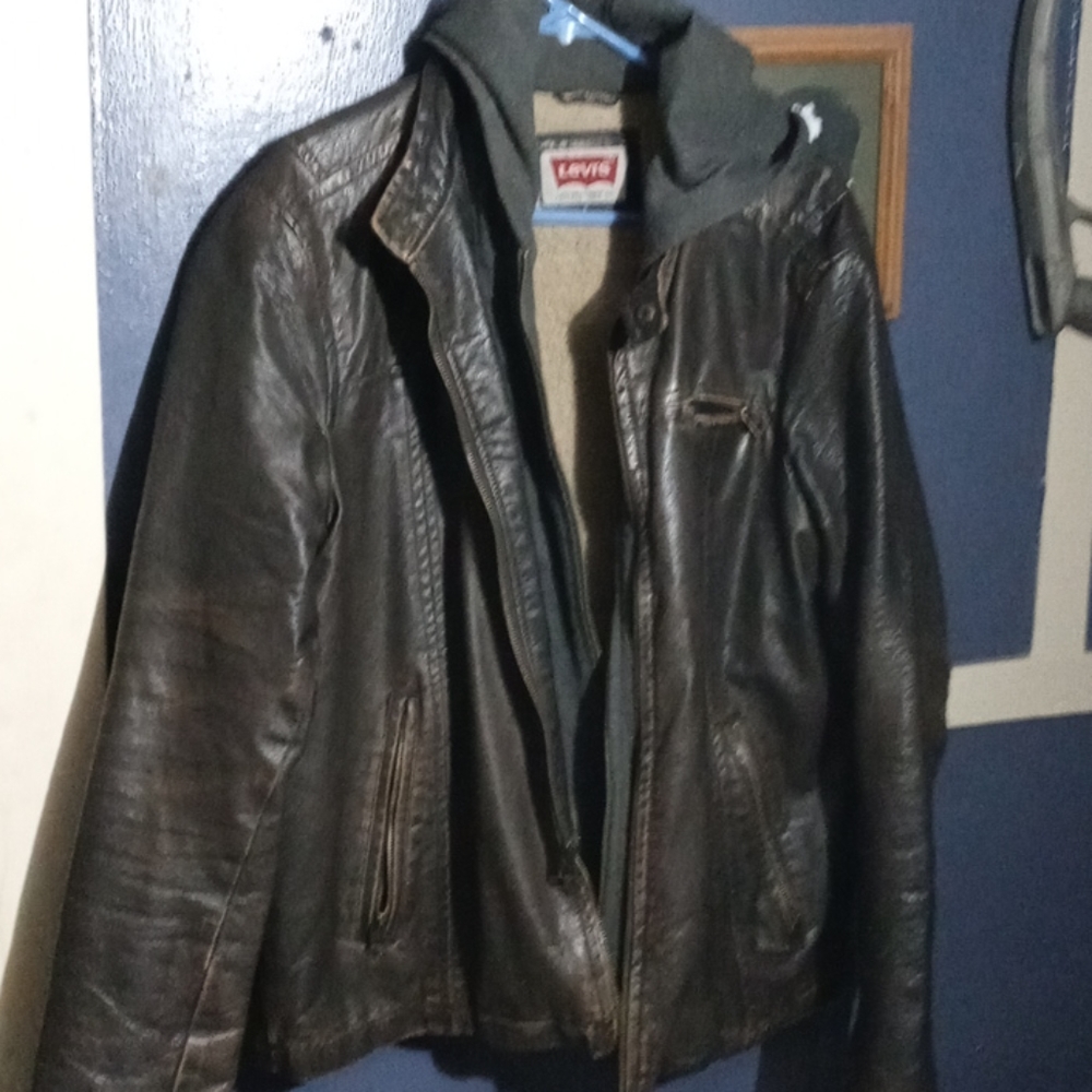 A brown leather Levi jacket with grey hood